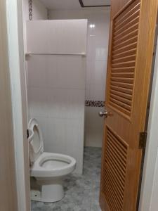 a bathroom with a toilet with the lid up at Lucky Guest house in Karon Beach +53 photos