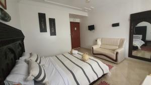 Letto o letti in una camera di Hotel Meftah Chaouen