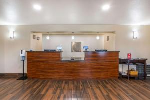 a lobby with a large wooden counter in a room at Comfort Inn and Suites Yuma I-8 in Yuma