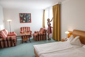 Postel nebo postele na pokoji v ubytování Hotel Exel