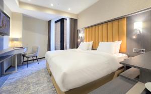 Postel nebo postele na pokoji v ubytování Griffin Hotel