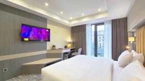 TV a/nebo společenská místnost v ubytování Griffin Hotel
