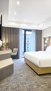 Postel nebo postele na pokoji v ubytování Griffin Hotel