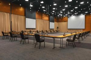 a large conference room with a long table and chairs at Radisson Blu Iveria Hotel in Tbilisi City +76 photos