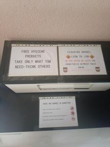 a sign on the top of a shelf at Historia Hostel in Skopje