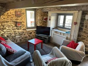 Μια τηλεόραση ή/και κέντρο ψυχαγωγίας στο Chalet confortable à Ascou avec vue sur la montagne