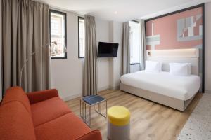 En eller flere senge i et værelse på Motto By Hilton Rotterdam Blaak