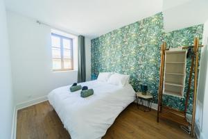 Postel nebo postele na pokoji v ubytování Escapade en Val de Saône T4 familial & jardin