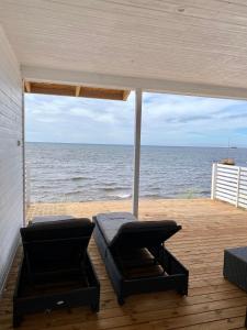 a view of the ocean from the deck of a house at Beach House in Kalajoki +10 photos