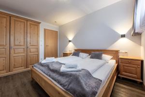 Postel nebo postele na pokoji v ubytování MountApart Ski in - Ski out - Sommercard zum halben Preis - Gültig von Juli bis September 2025