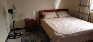 Postel nebo postele na pokoji v ubytování Palm Suites