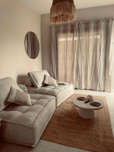 Posezení v ubytování L'essentiel Home By Chloé
