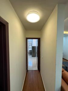 an empty hallway with a light on the ceiling at Appartement F4 situé à Coleah in Conakry +5 photos