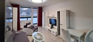 Posedenie v ubytovaní Útulný apartmán v centru, s krásným výhledem