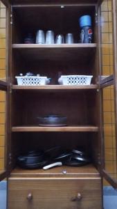 a wooden shelf with plates and bowls on it at LiveRio Hostel Ipanema in Rio de Janeiro