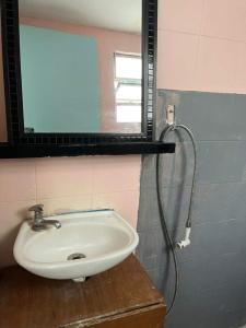 a bathroom with a sink and a shower at LiveRio Hostel Ipanema in Rio de Janeiro
