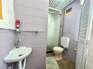a bathroom with a sink and a toilet at LiveRio Hostel Ipanema in Rio de Janeiro