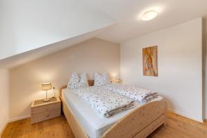 Postel nebo postele na pokoji v ubytování Apartment Weingut Zail