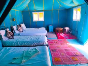 Postel nebo postele na pokoji v ubytování Royal Morocco Camp