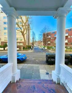 a view of a parking lot with columns and cars at Central Studios Near Hyde Park in London +36 photos