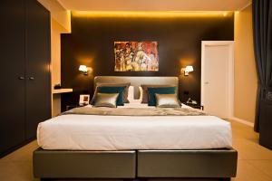 Postel nebo postele na pokoji v ubytování Delle Vittorie Luxury Rooms&Suites