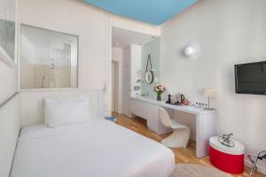 A bed or beds in a room at Casati Hotel - Adults Only
