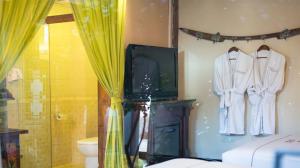 Big Tree Guesthouse - Naxi old style客房内的一张或多张床位