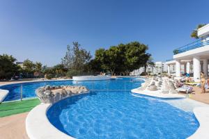 a pool with a water slide in a resort at Estudio Paraiso del Sur in Playa Paraiso