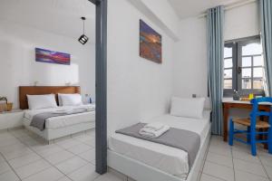 Postel nebo postele na pokoji v ubytování Kings Hersonissos Hotel