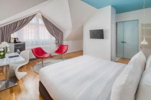 A bed or beds in a room at Casati Hotel - Adults Only