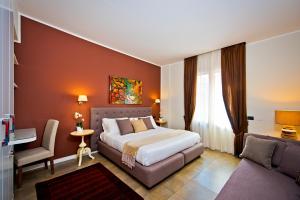 Postel nebo postele na pokoji v ubytování Delle Vittorie Luxury Rooms&Suites
