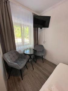 TV a/nebo společenská místnost v ubytování Green Residence Brasov