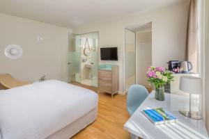 A bed or beds in a room at Casati Hotel - Adults Only