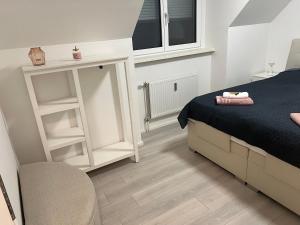Łóżko lub łóżka w pokoju w obiekcie KOSI Thermen-Vulkanland Appartement