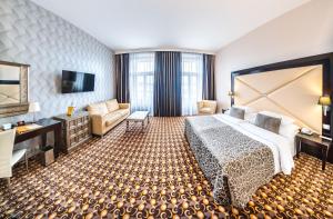 Postel nebo postele na pokoji v ubytování Grandior Hotel Prague