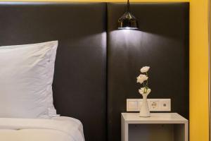 A bed or beds in a room at Casati Hotel - Adults Only