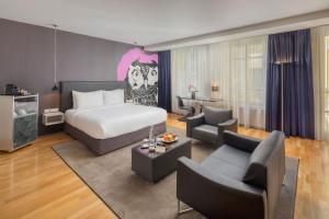 A bed or beds in a room at Casati Hotel - Adults Only
