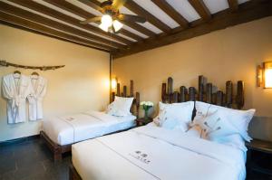 Big Tree Guesthouse - Naxi old style客房内的一张或多张床位