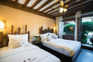 Big Tree Guesthouse - Naxi old style客房内的一张或多张床位