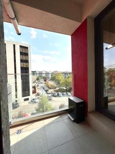 a window in a building with a tv in a room at Studio Plaza Faza 2 in Militari
