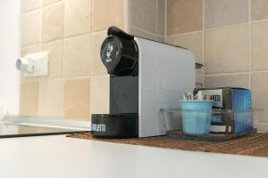 a coffee maker sitting on top of a counter at La Greca 59 in Putignano