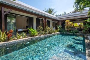 an image of a swimming pool in front of a house at Villa Paradis in Grand Baie +83 photos