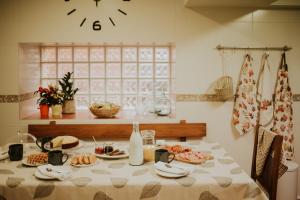 a table with food on it in a kitchen at Casa Rural Osingain in Caicedo Yuso