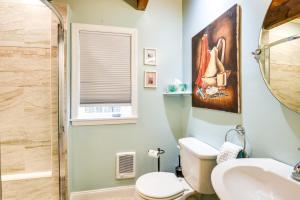 a bathroom with a toilet and a sink at North Conway Vacation Rental Near Saco River! in North Conway +33 photos