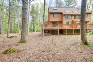 a large wooden house in the woods with trees at North Conway Vacation Rental Near Saco River! in North Conway