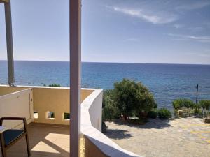 a view of the ocean from a building at Horizon Beach Hotel in Plakias