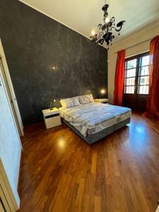 Ένα ή περισσότερα κρεβάτια σε δωμάτιο στο Moncalieri Villa Maddalena