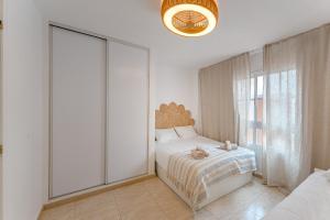 Una cama o camas en una habitación de 2 BDR cozy ap in Callao Salvaje