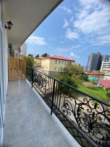 a balcony with a view of a city at Black Sea Pearl in Makhinjauri