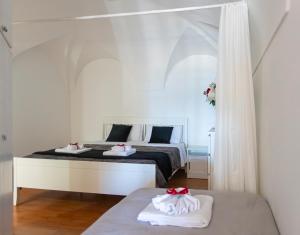 Ένα ή περισσότερα κρεβάτια σε δωμάτιο στο Casa Irene